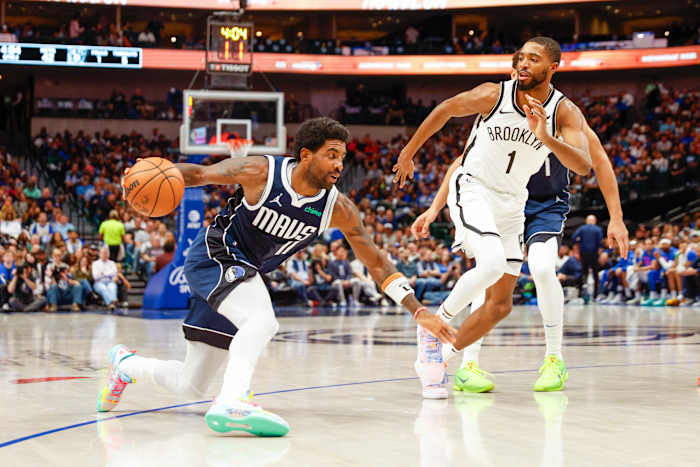 Dallas Mavericks superstar Kyrie Irving attacking the Brooklyn Nets' defense.